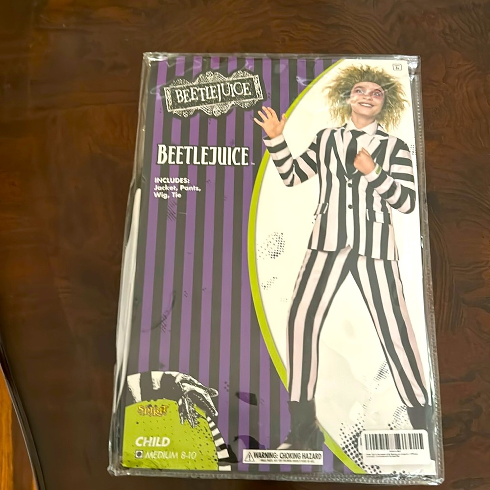 Brand new never opened Beetlejuice costume. Child size medium.